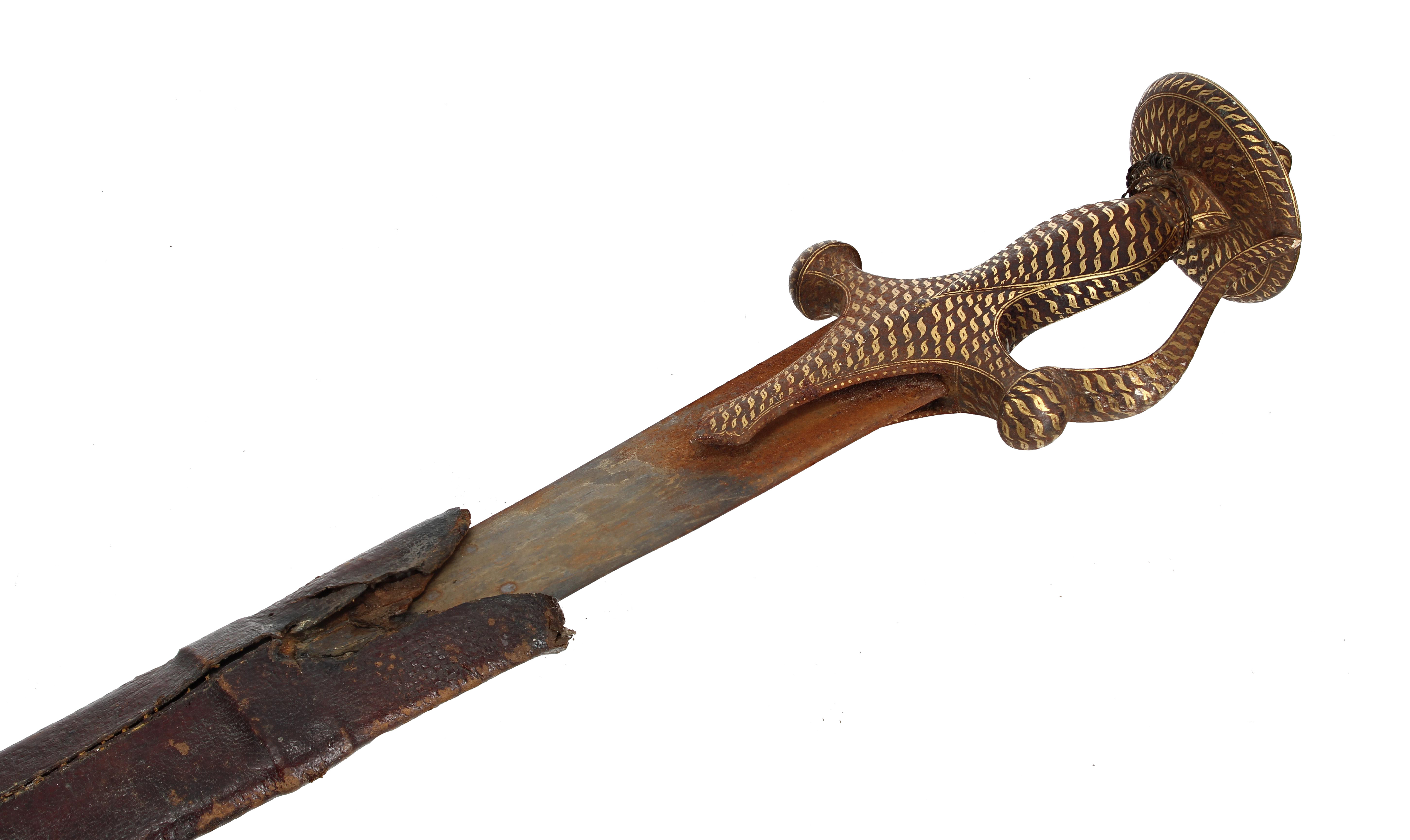 Auctioneer Chris Baker holding the rare Tulwar sword